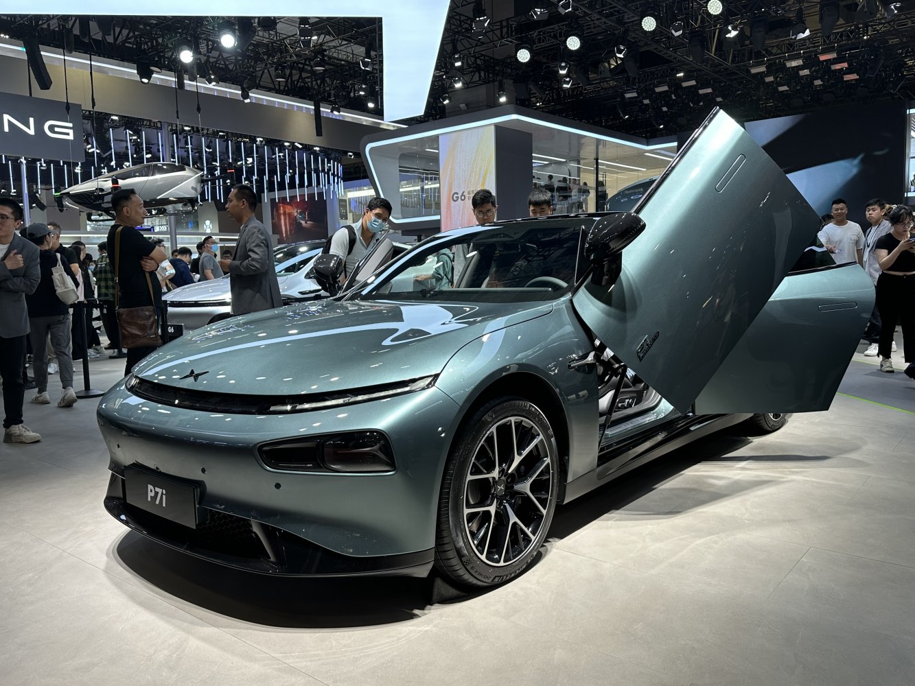 Electric sedan with butterfly doors and sleek front design