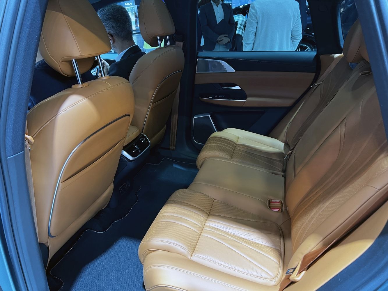 Brown leather rear seating and spacious interior with modern door panel
