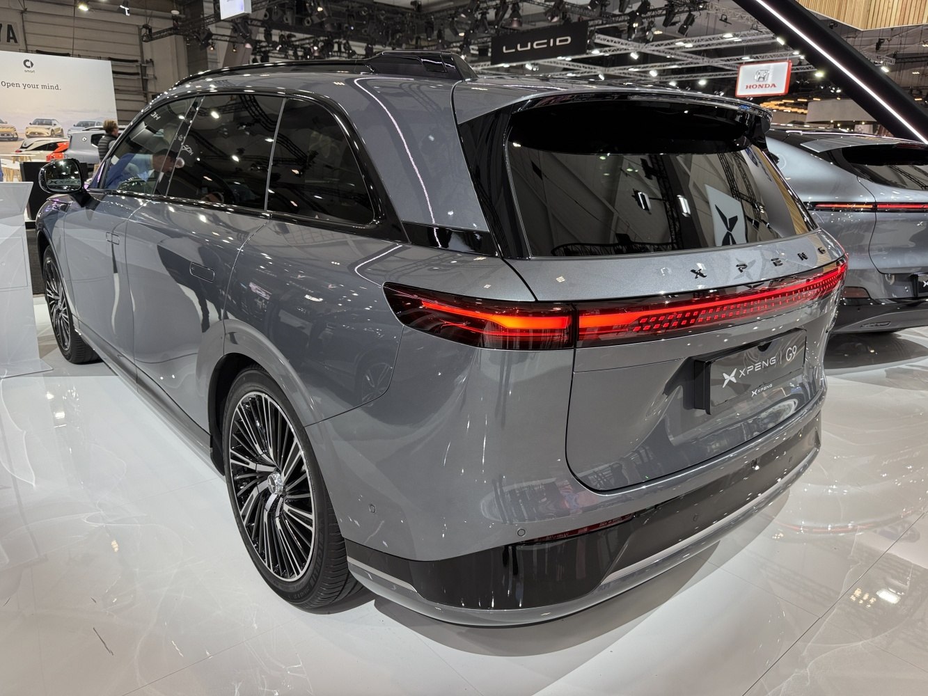 Rear view of sleek electric SUV with full-width LED taillight bar