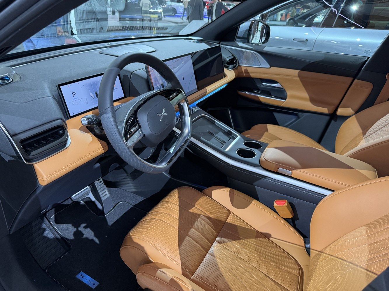 Digital dashboard with dual screens and tan leather seats