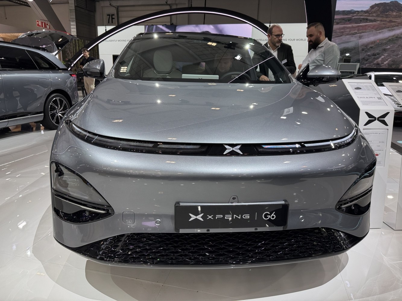 Front view of electric crossover with sleek LED headlights and aerodynamic design