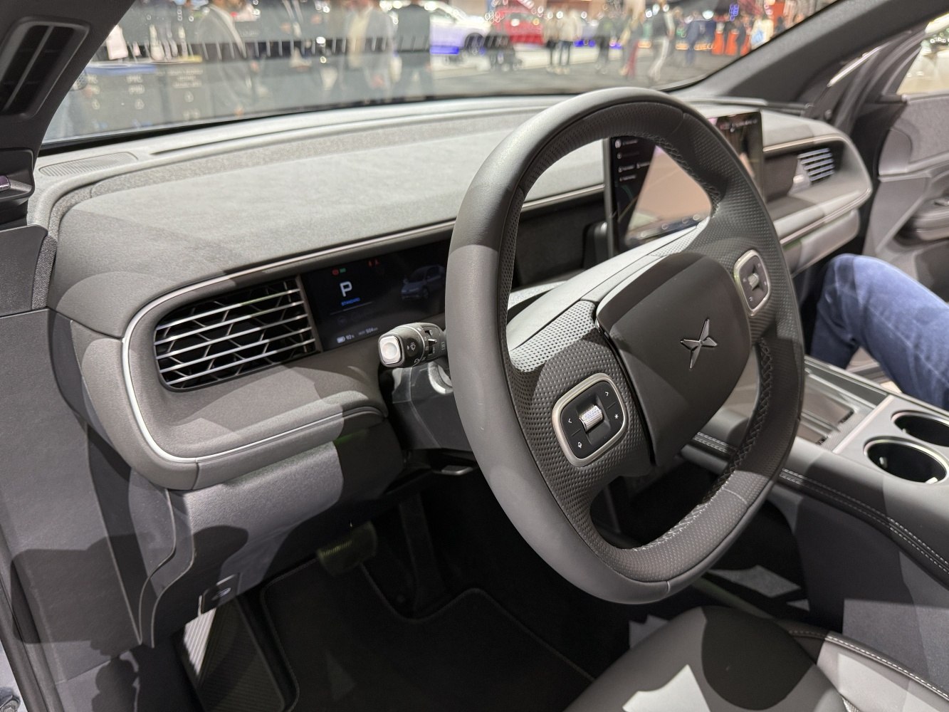 Futuristic steering wheel with digital dashboard and modern interior design