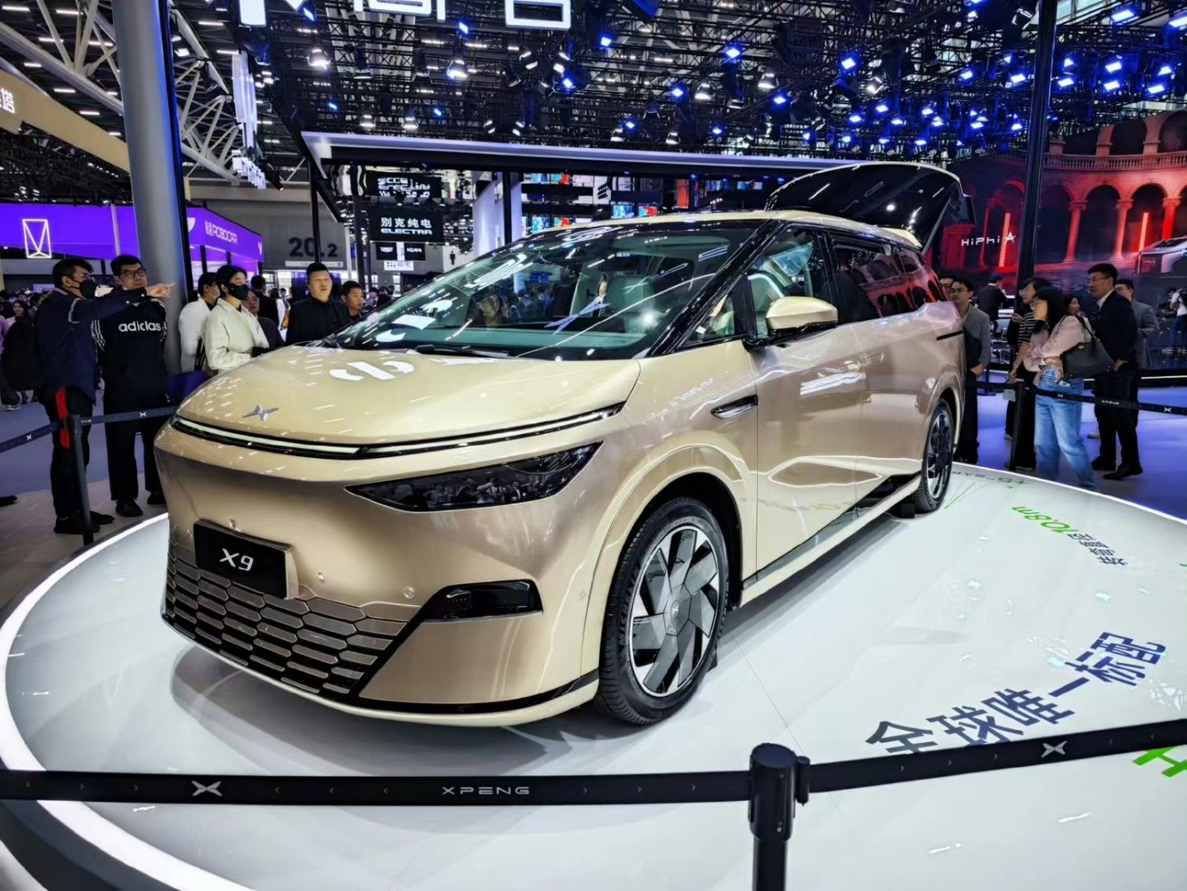 Front and side view of modern electric SUV with LED headlights and futuristic wheels
