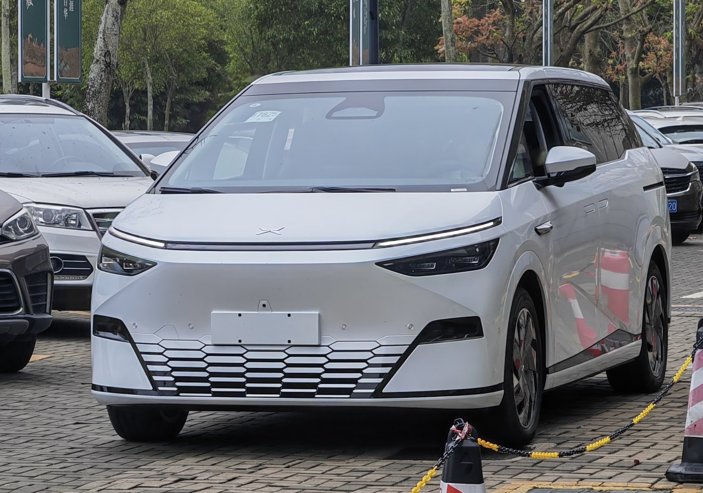 Front view with sleek LED headlights and hexagonal grille design