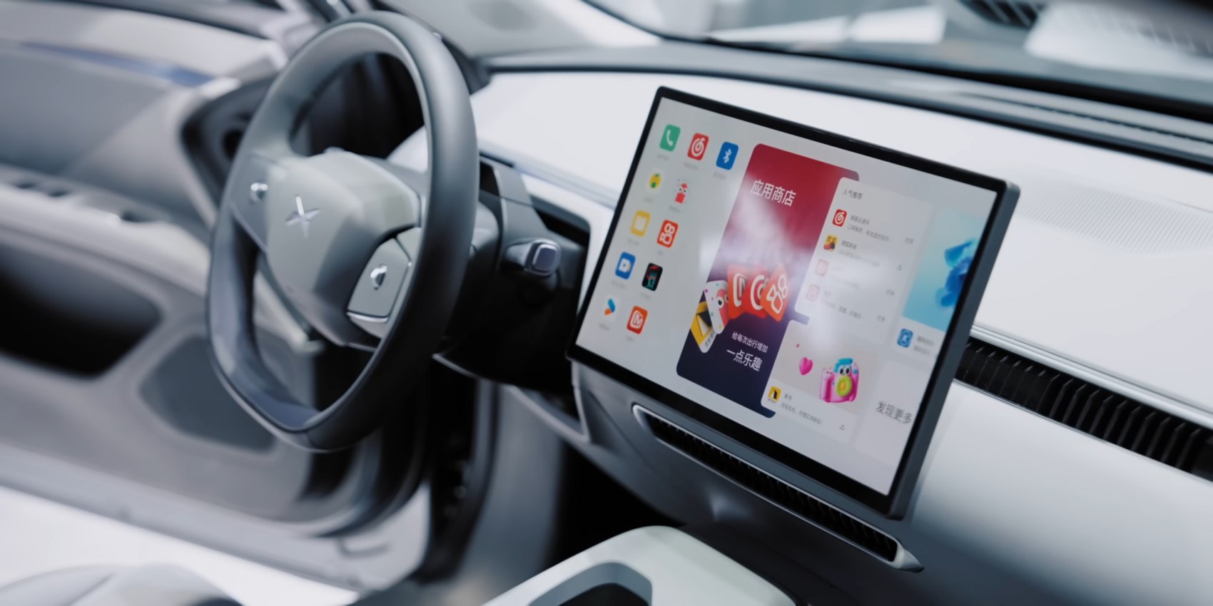 Modern car interior with large touchscreen and steering wheel