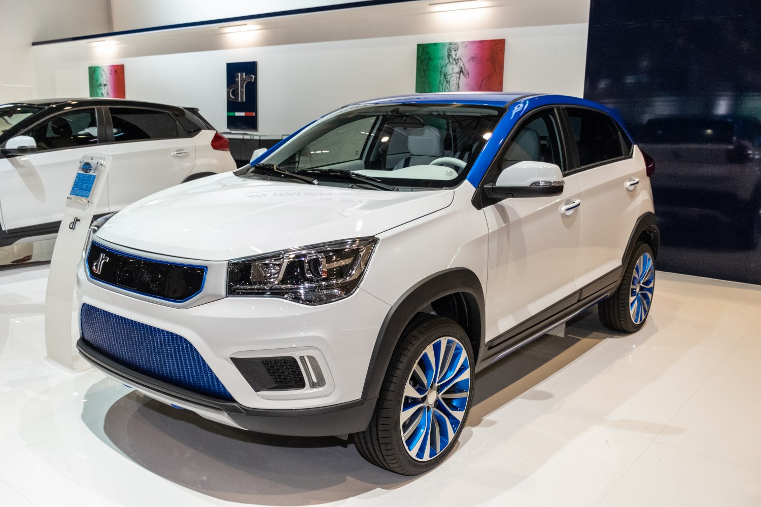 Electric SUV with blue trim accents and multi-spoke wheel design