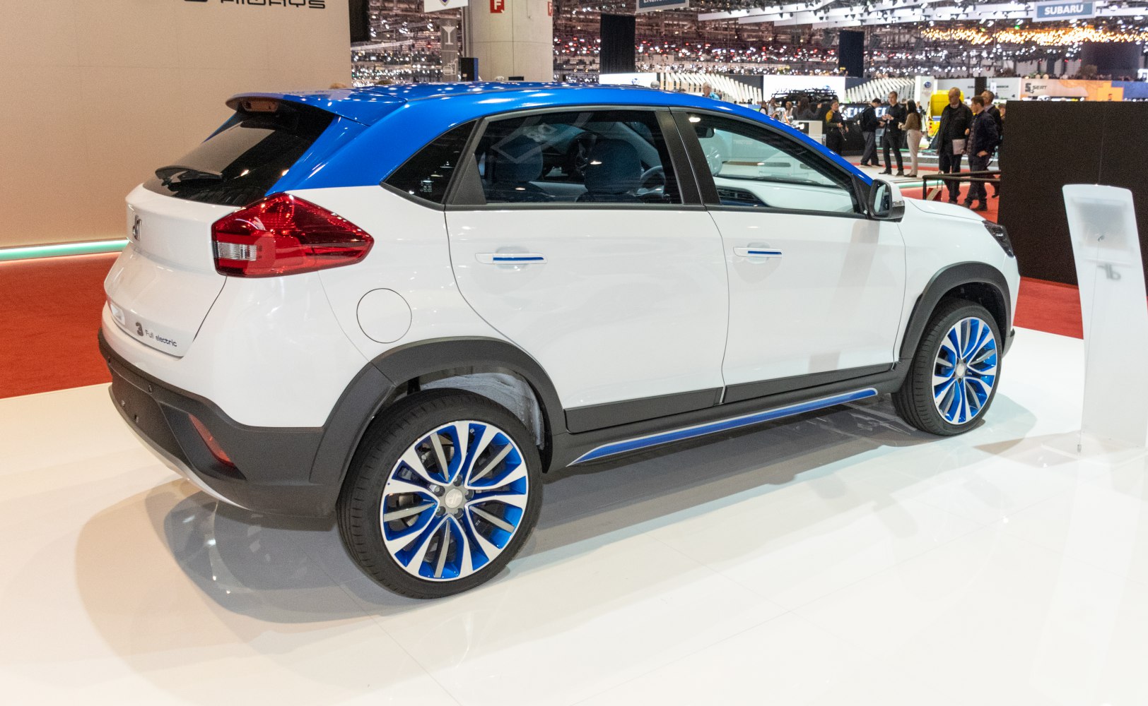 Compact SUV with two-tone white and blue paint and blue-accented alloy wheels