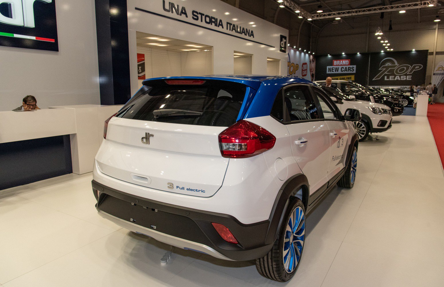 Electric compact SUV rear with blue roof and wheels