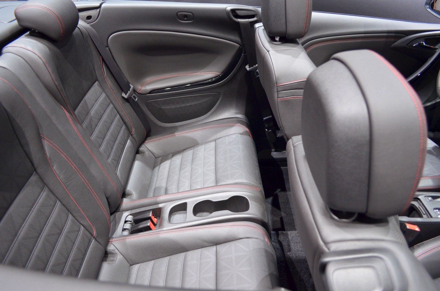 Rear leather seats with red stitching and integrated cup holders