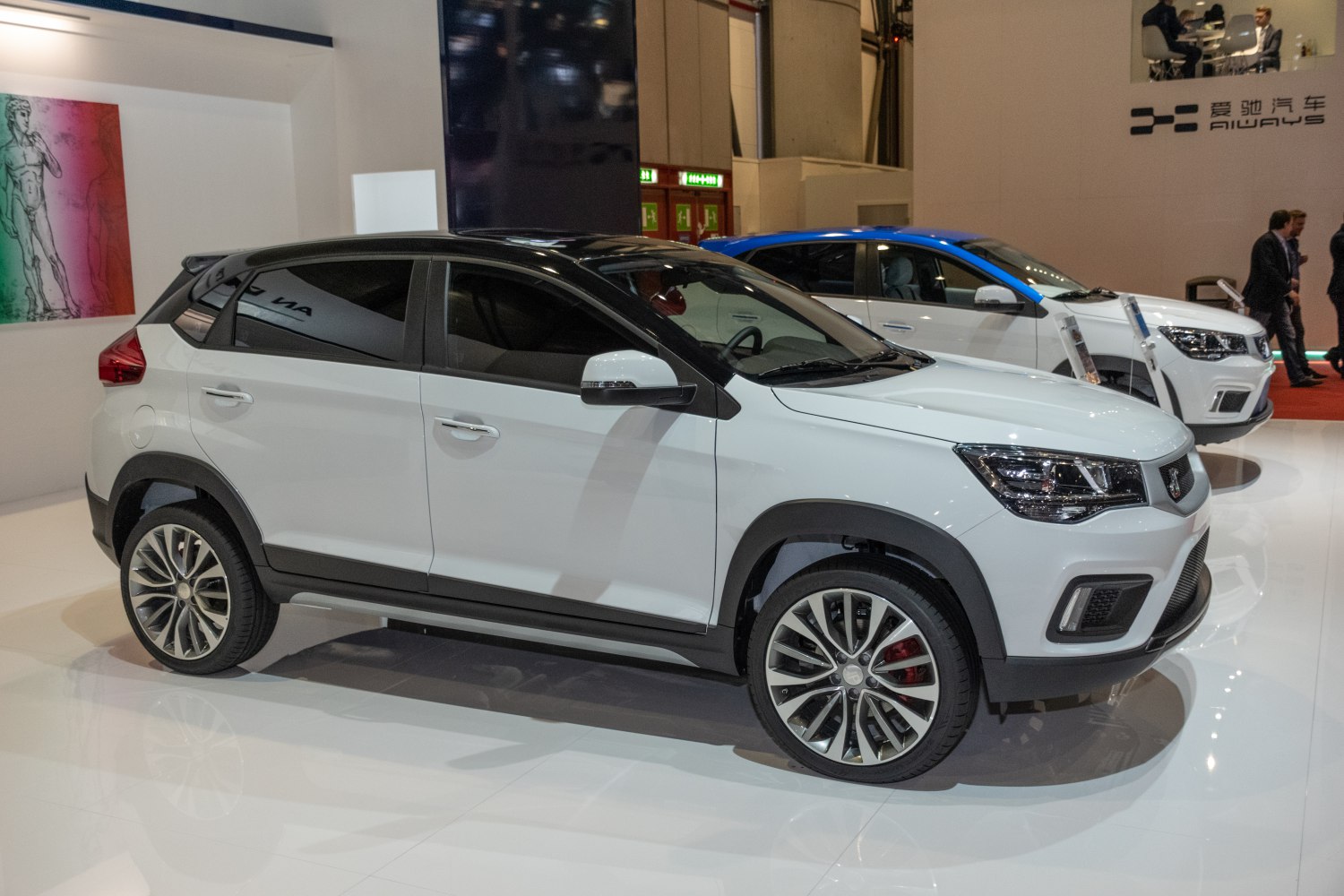White SUV with black roof and sporty alloy wheels