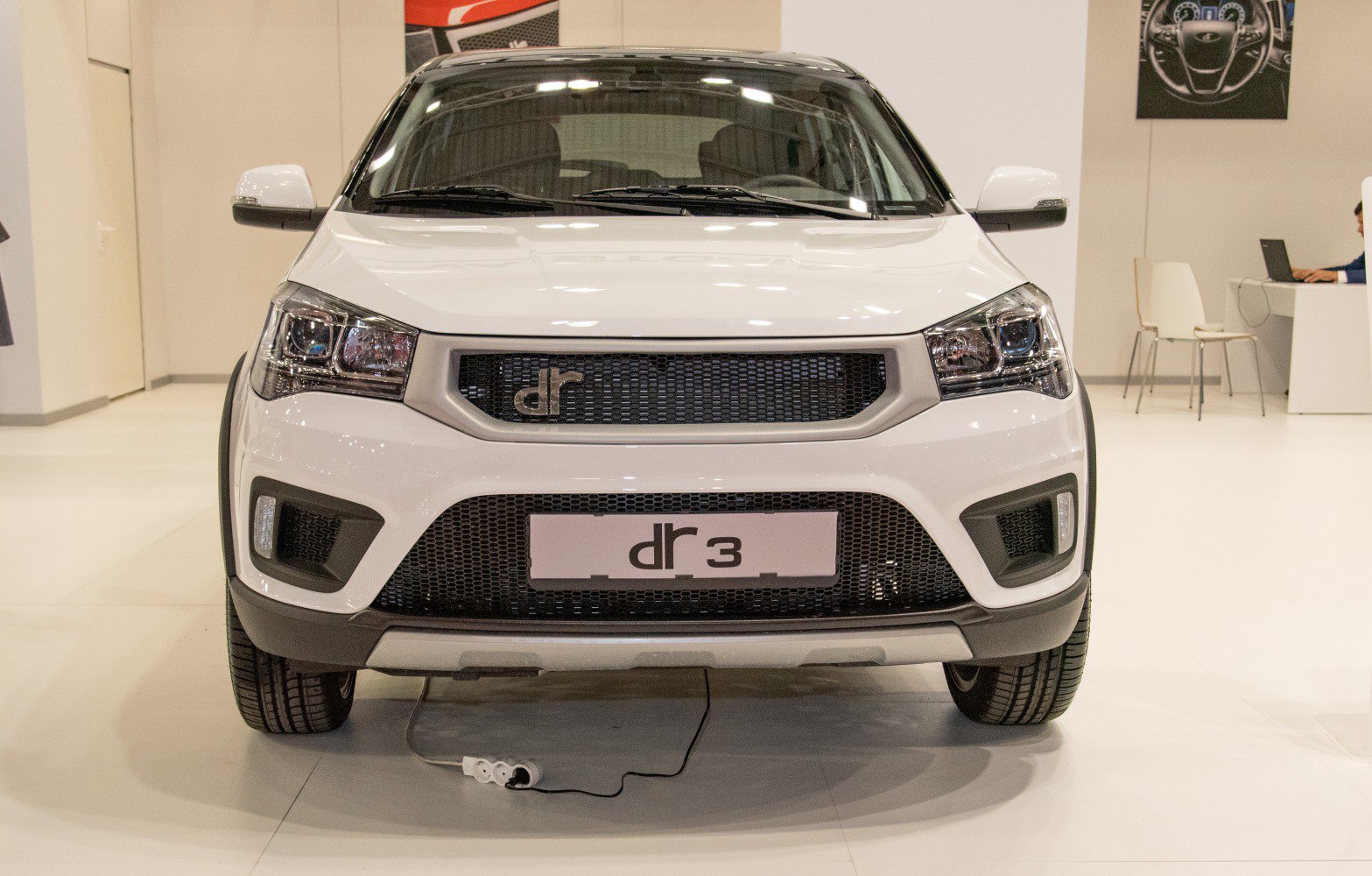 Front view with mesh grille and modern headlights of compact SUV