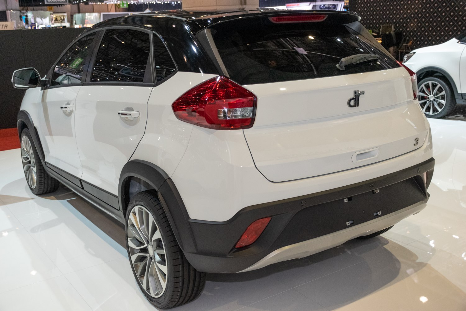 Rear view of compact SUV with angular tail lights and black roof