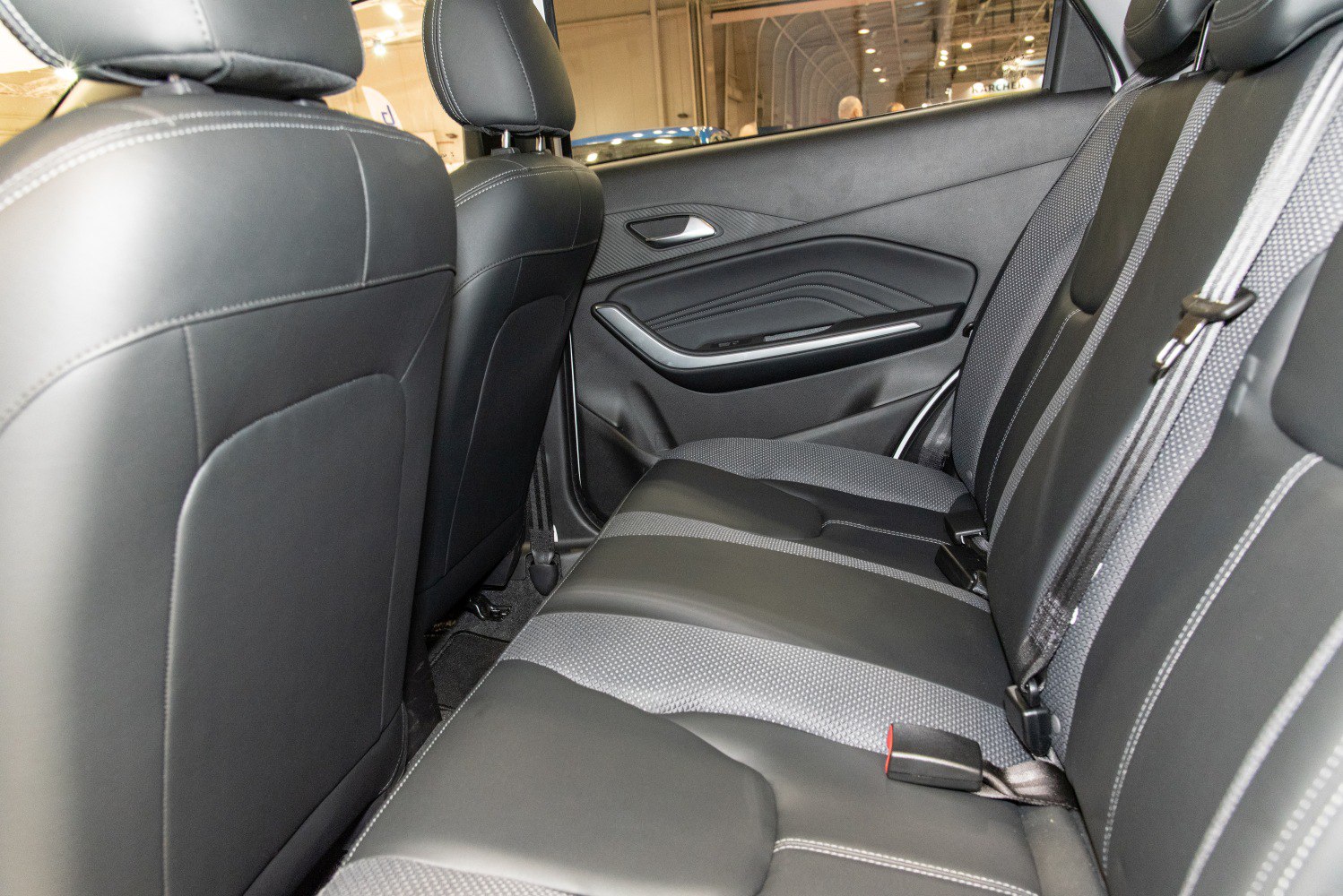 Rear seating with black leather and cloth combined upholstery