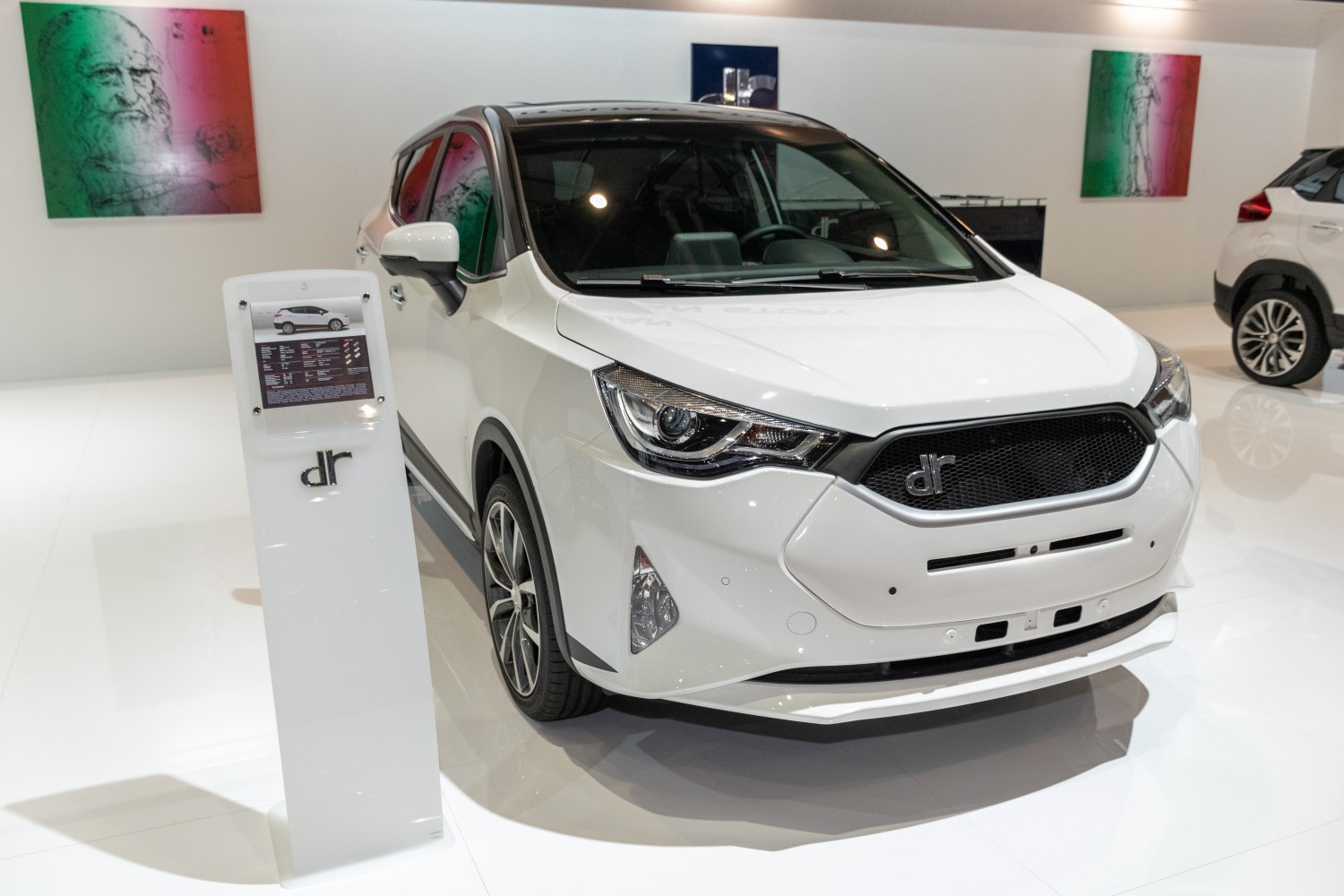 Front exterior with aggressive headlights and mesh grille design