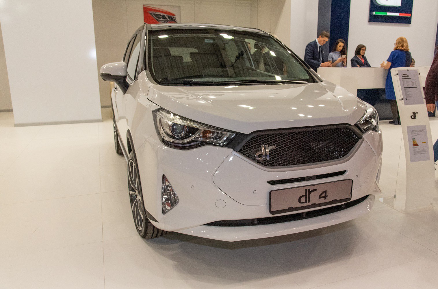 Front view with hexagonal mesh grille and sharp headlamp design