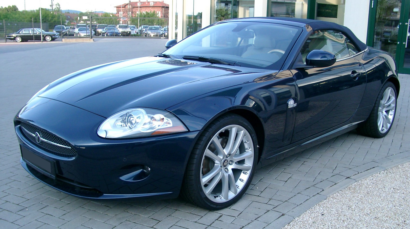 Aerodynamic front design with alloy wheels on convertible roadster