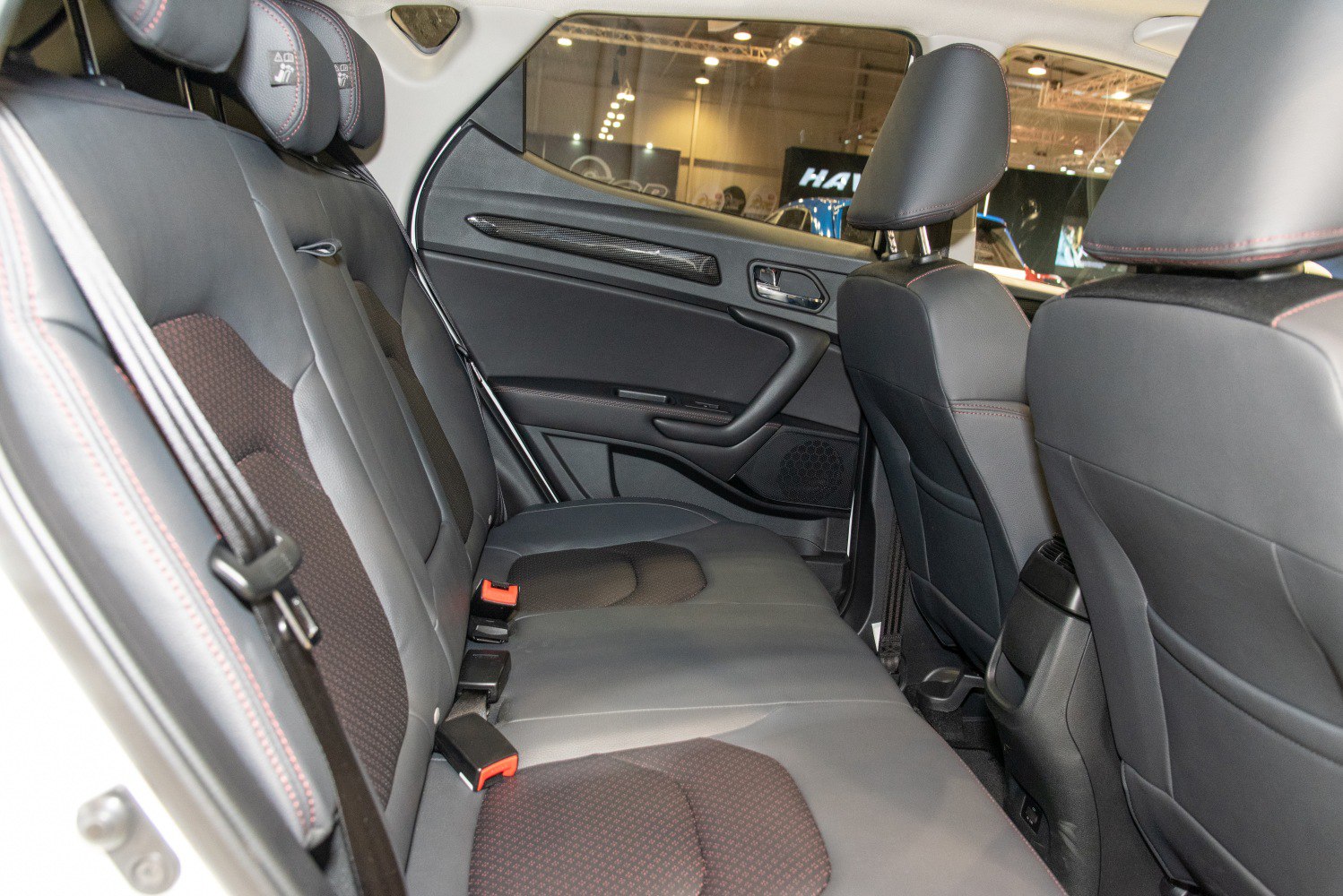 Rear seating with black upholstery and patterned inserts