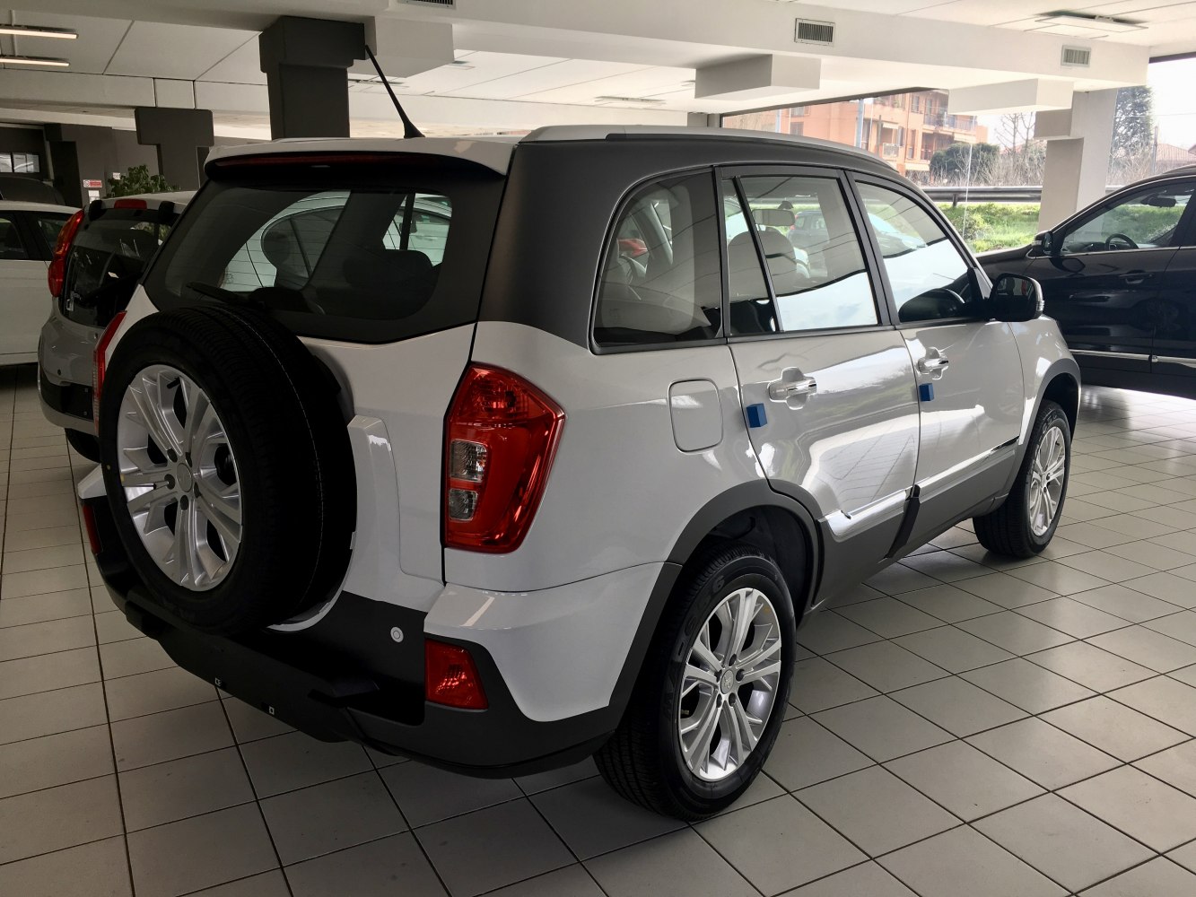 SUV with rear mounted spare wheel and contrasting black roof