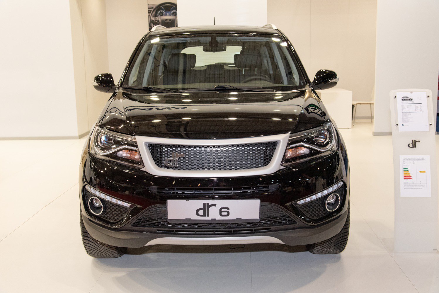 Front view showcasing grille, LED headlights, fog lights on SUV.