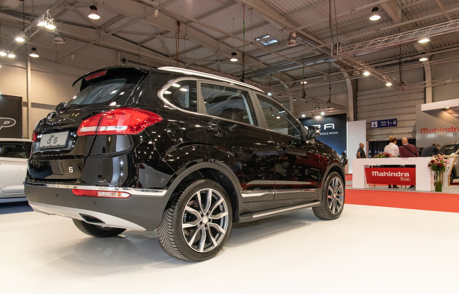 Rear side view of black compact SUV with alloy wheels