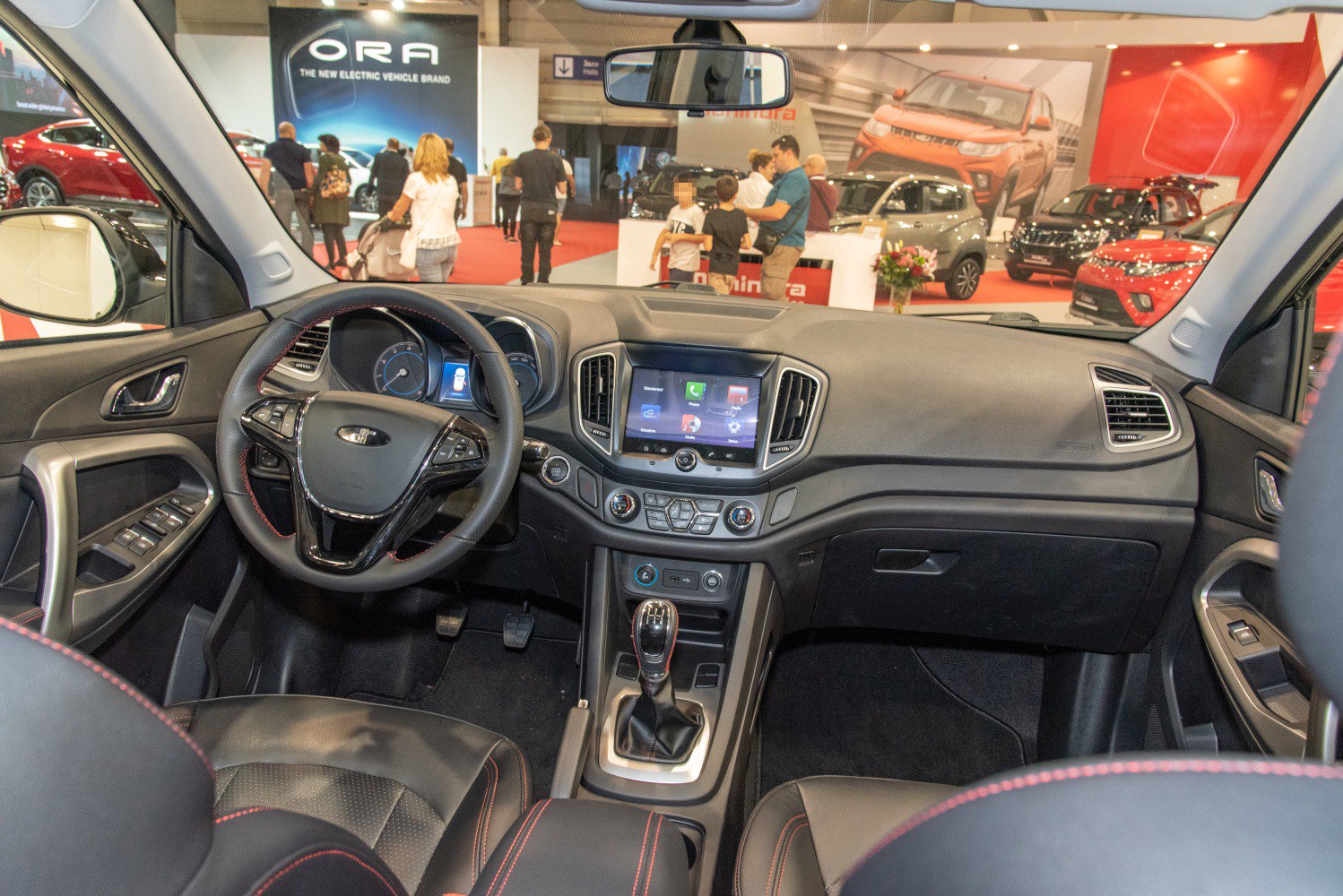 Modern car dashboard with touchscreen and manual gear shift
