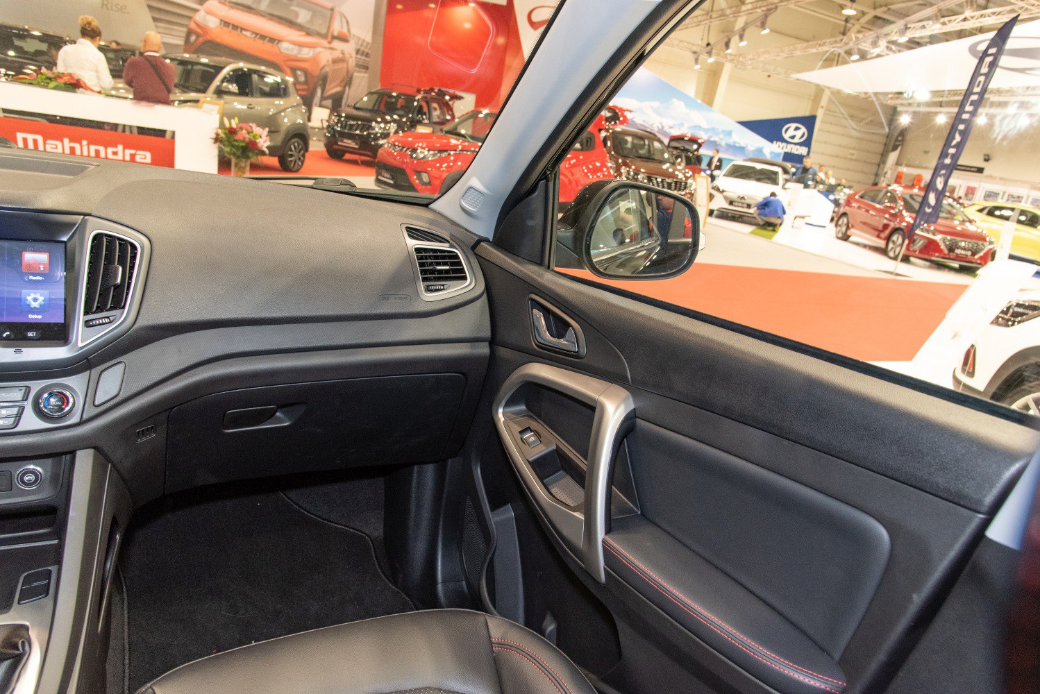 Front passenger side dashboard and door panel with controls