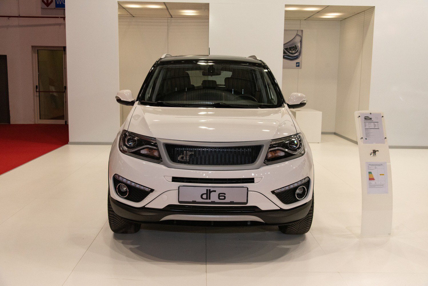 Front view of a modern SUV with distinct headlights and grille