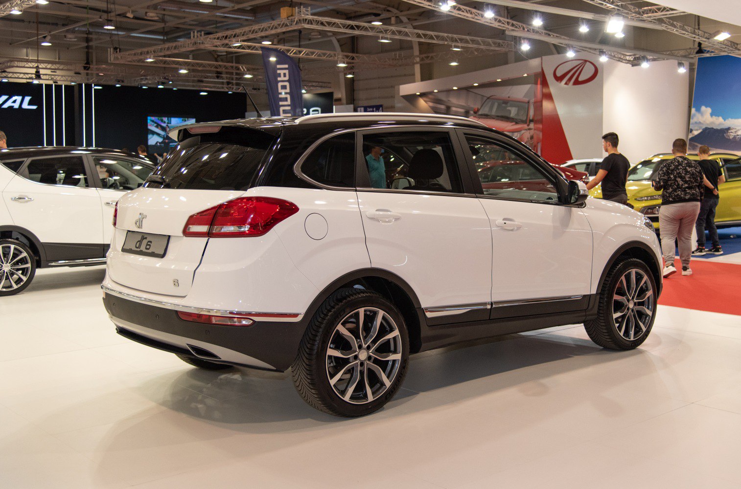 Rear side view of SUV with two-tone paint and alloy wheels
