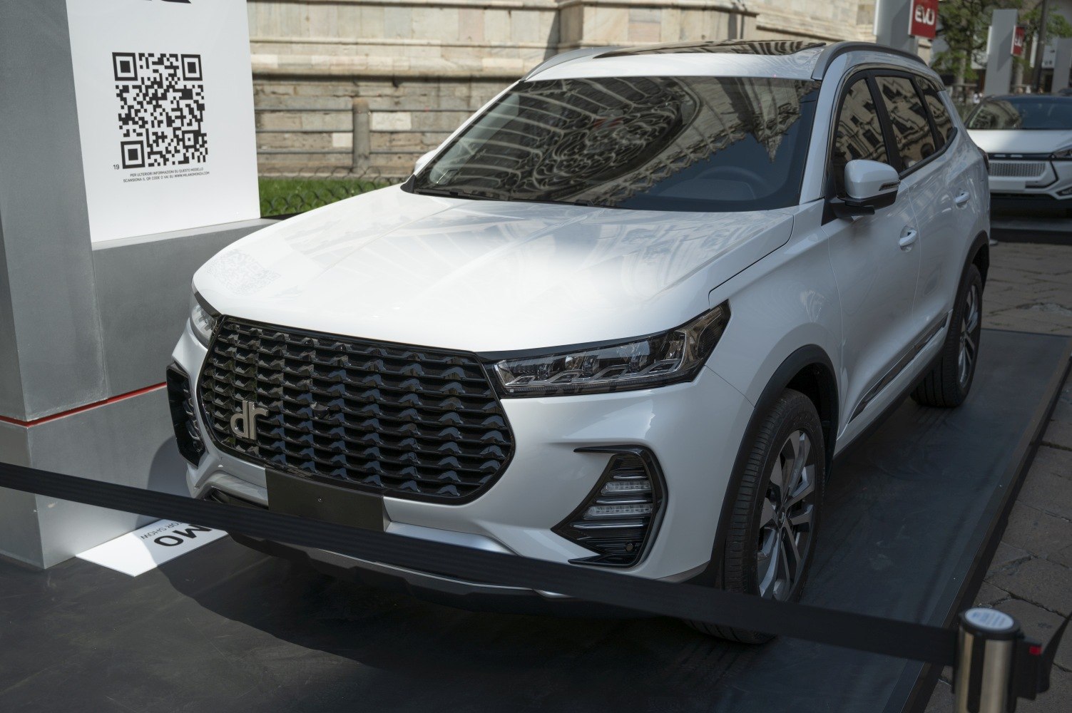Sleek SUV front with large grille and LED headlights