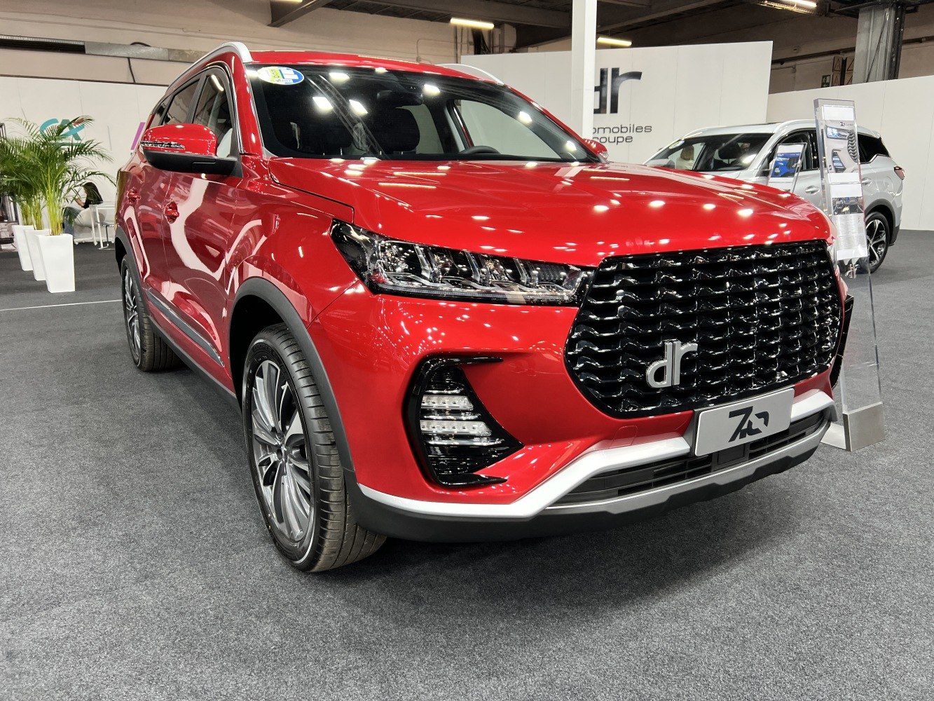 Modern SUV front with black grille and LED headlights