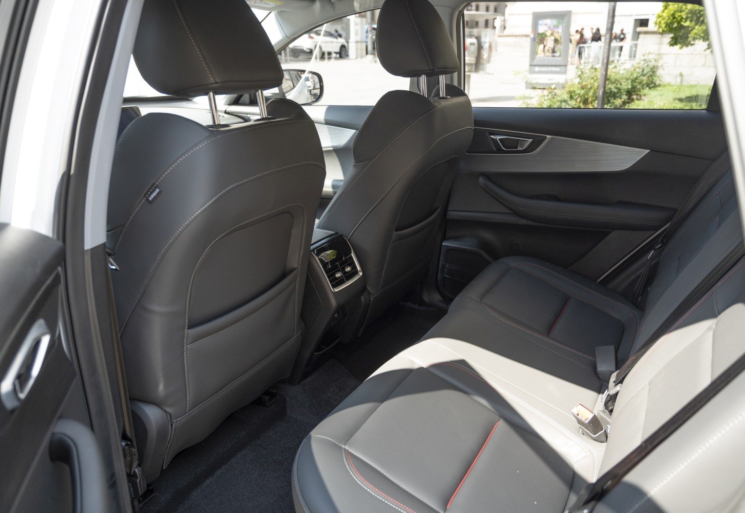 Premium leather rear seats with detailed stitching and rear air vents.