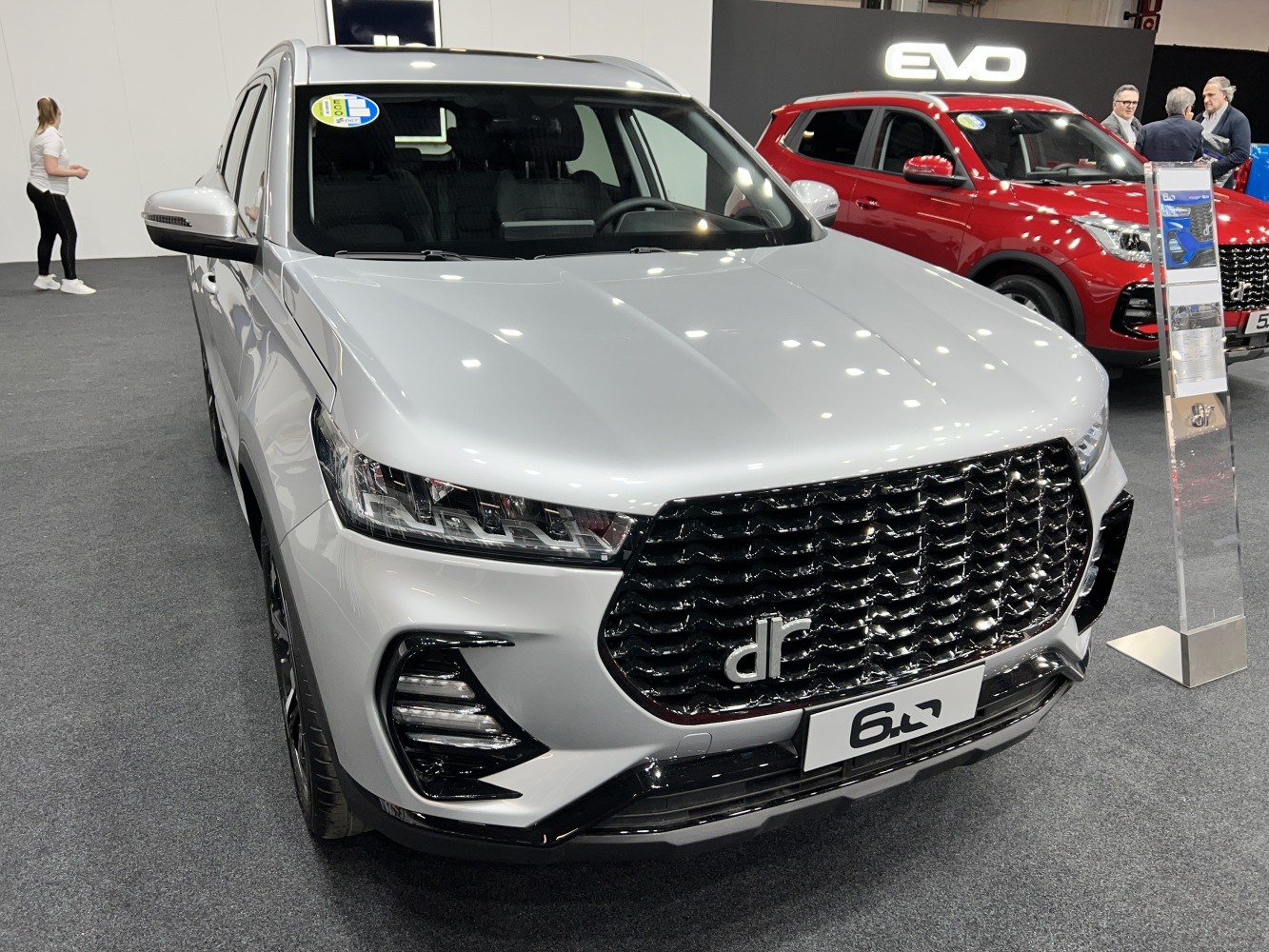 SUV front with large black mesh grille and sleek LED headlights