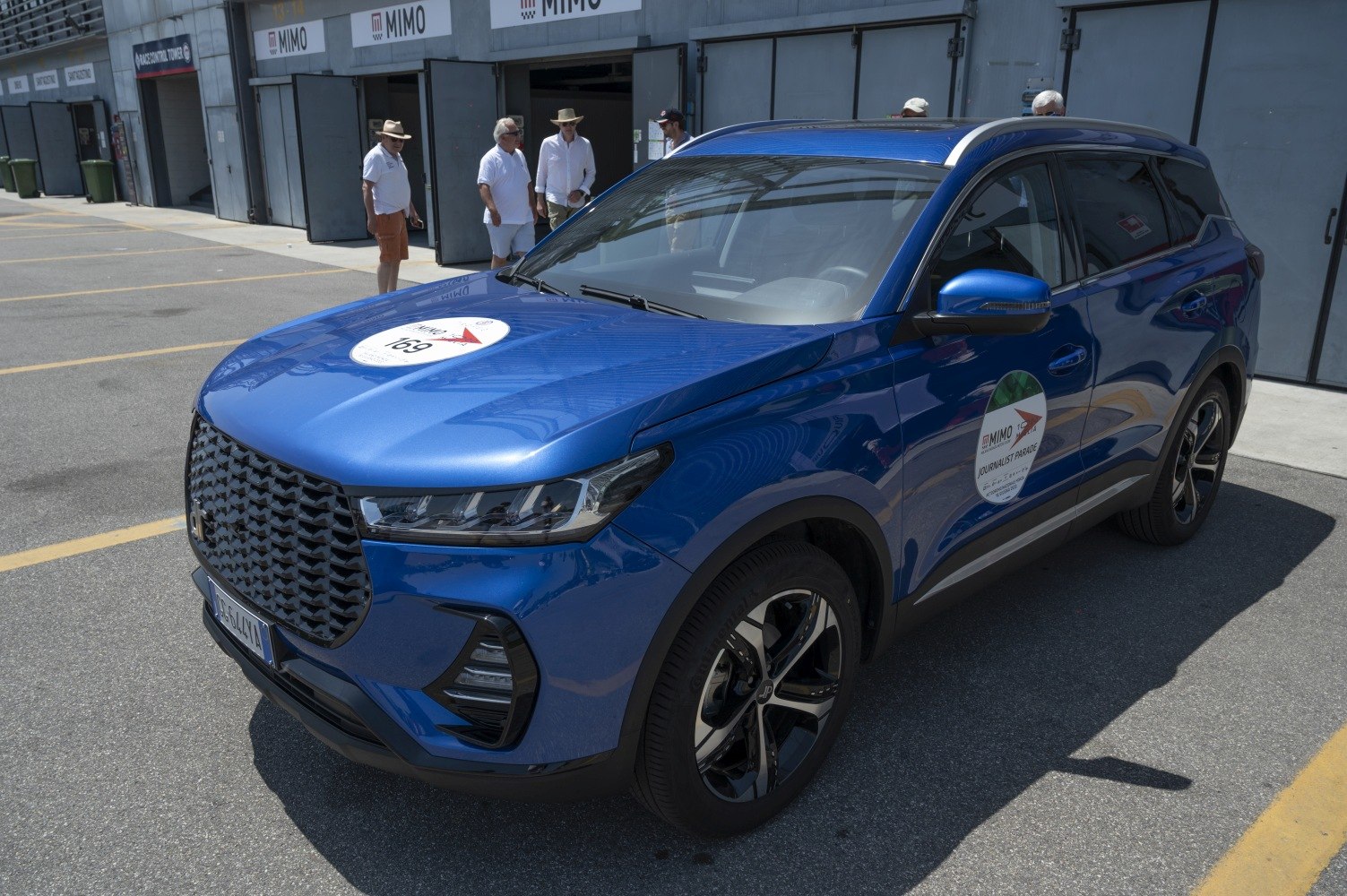Blue SUV with large front grille and LED headlights