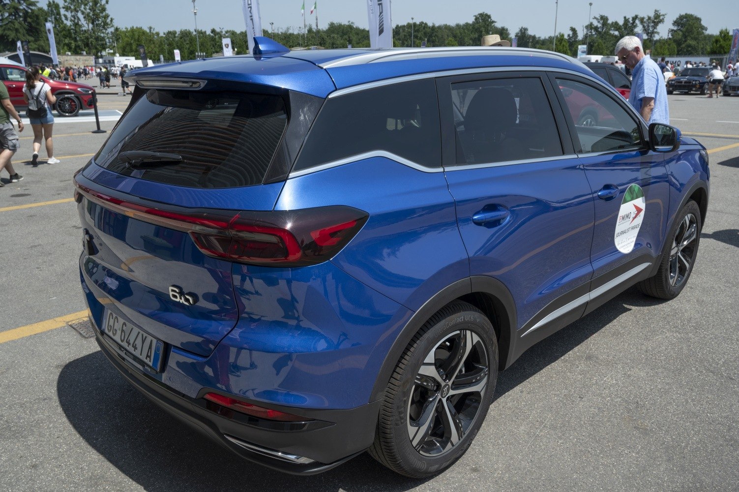 Rear and side view of blue SUV with distinctive taillights and alloy wheels