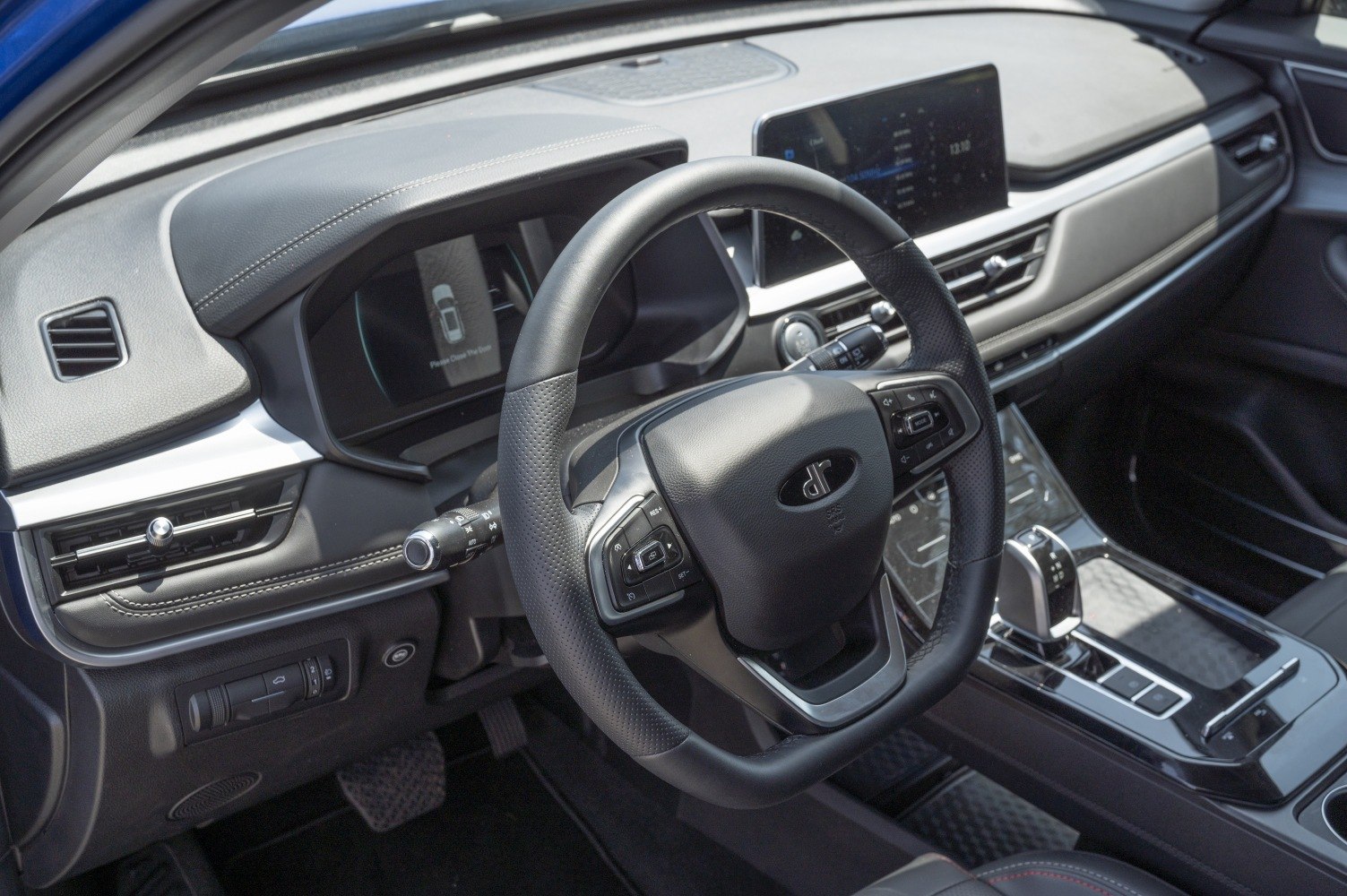 Digital instrument cluster and multifunction steering wheel in modern car interior
