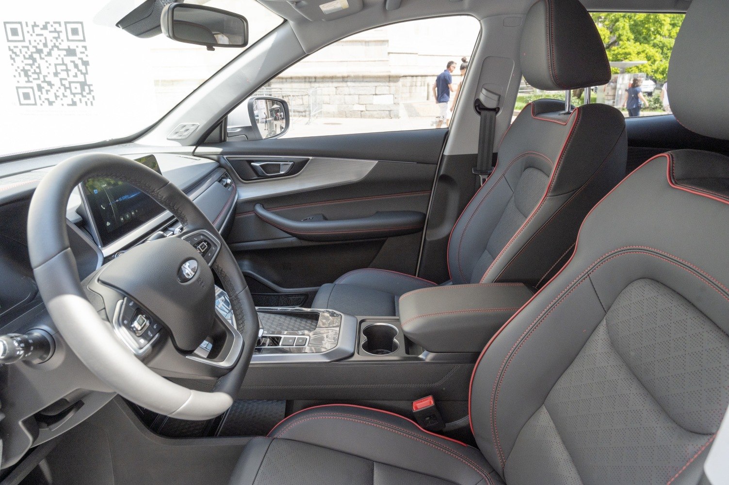 Leather seats with red stitching and digital dashboard display