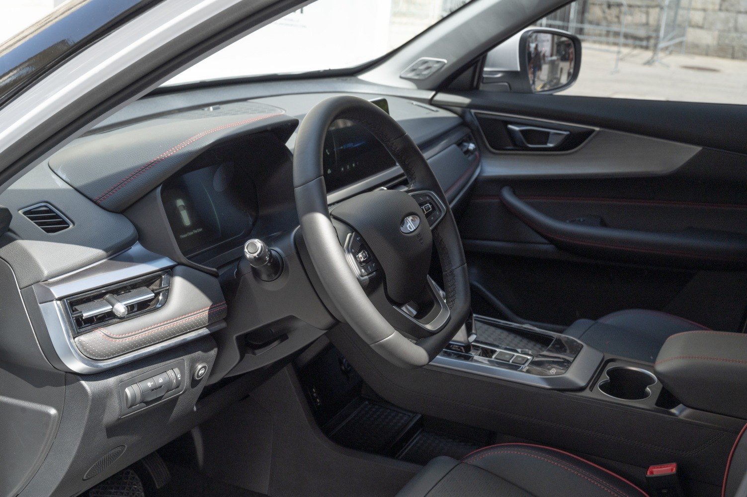 Modern car interior with dashboard, steering wheel, and center console