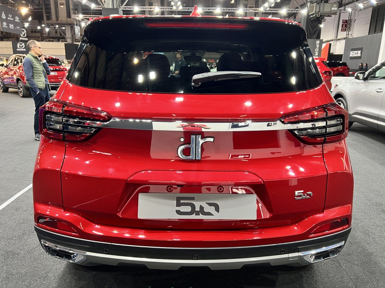 Red SUV rear with chrome trim and distinctive taillights