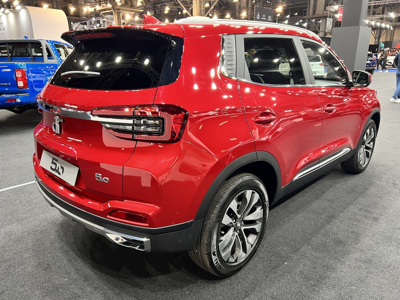 Red SUV rear and side view with modern rear lights and alloy wheels