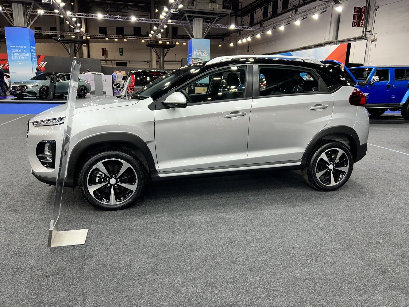 Side profile of a compact SUV with two-tone paint and alloy wheels