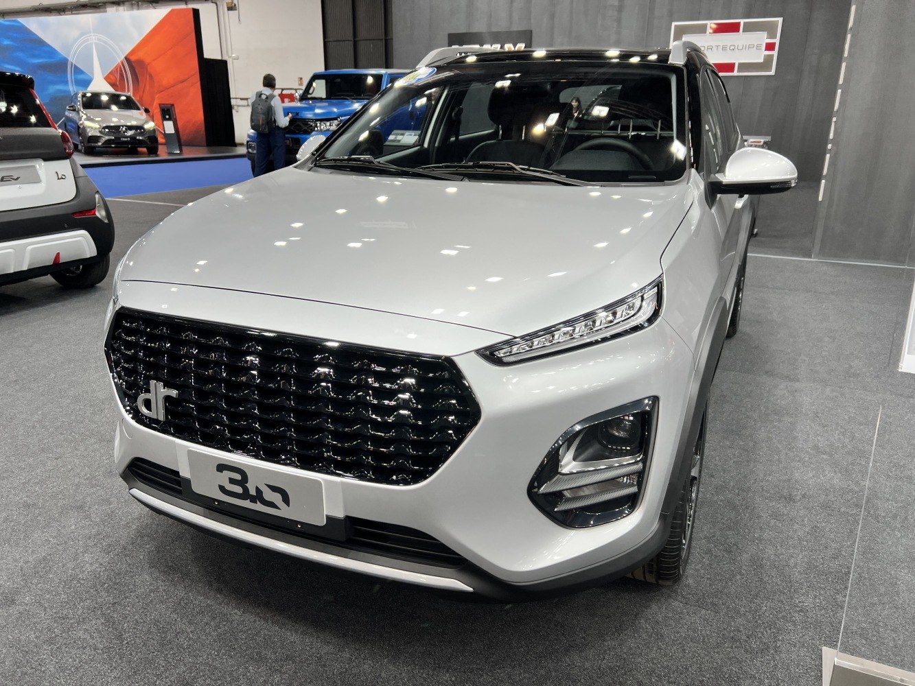 Front view with sleek LED headlights and bold black grille