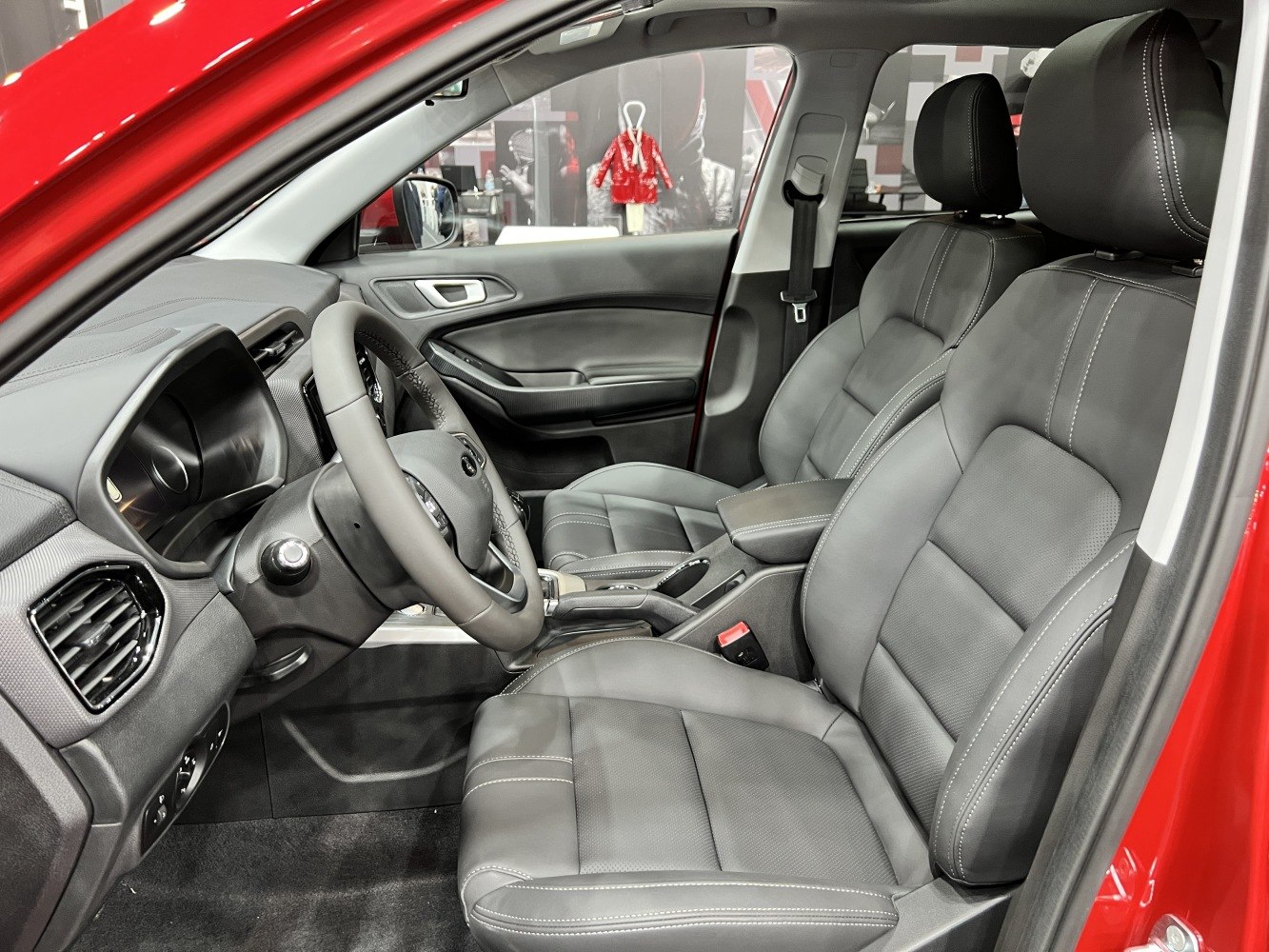Leather front seats with modern dashboard and steering wheel
