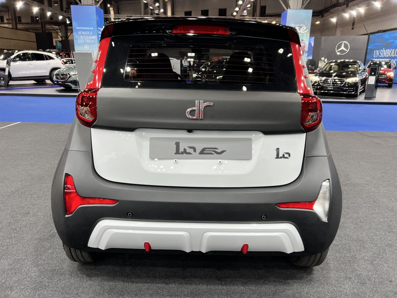 Compact electric hatchback rear with distinct tail lights and bumper.