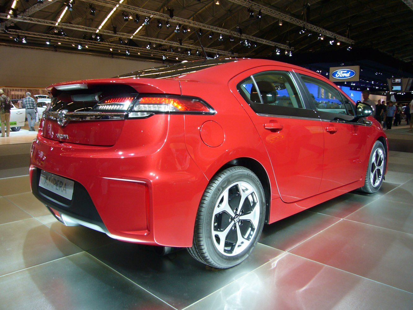 Red hatchback rear-side, LED tail lights, modern alloy wheels