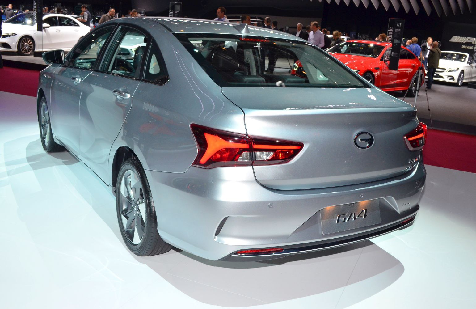Rear angled view of sedan with distinctive tail lights and smooth body lines