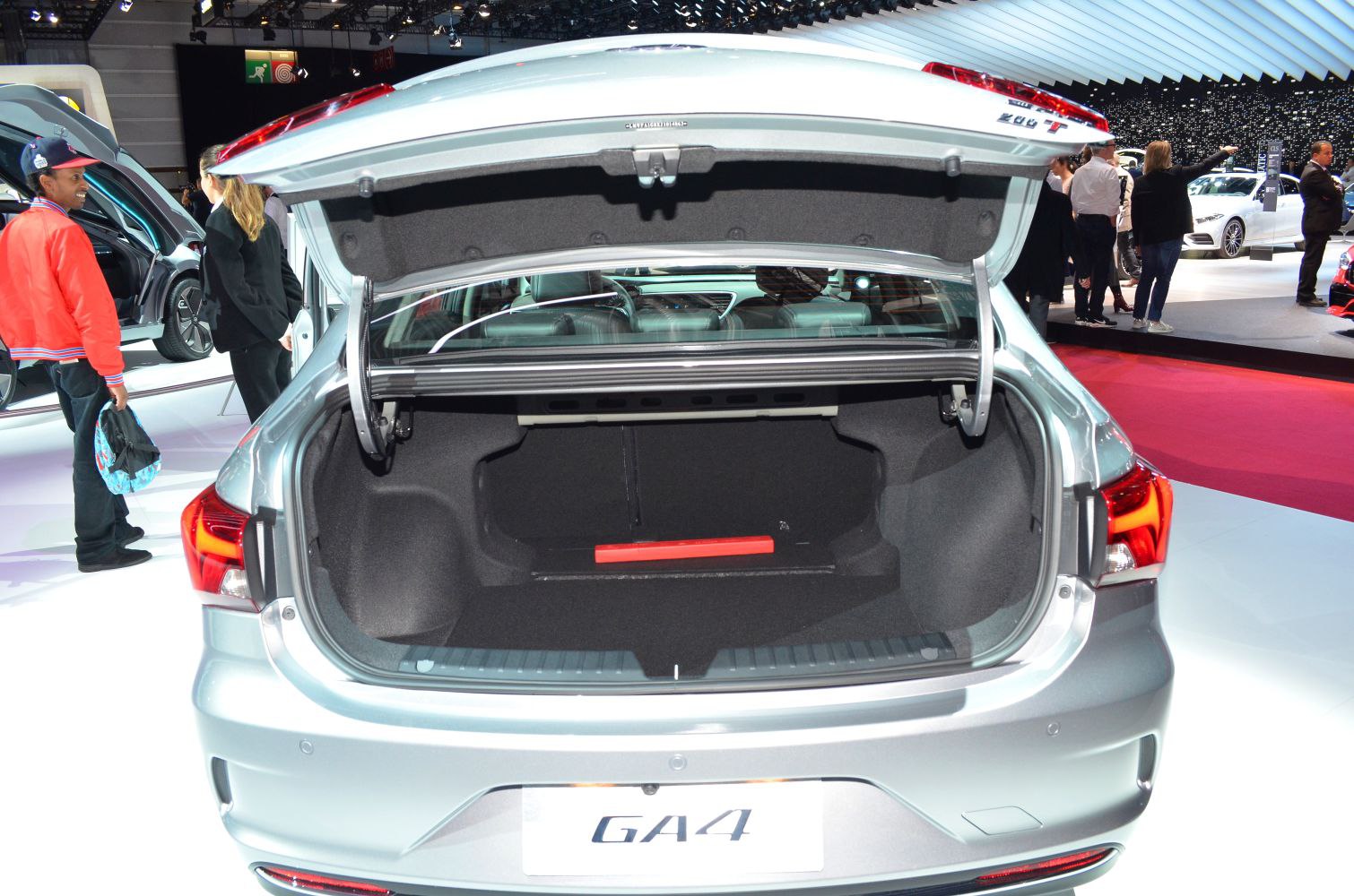 Spacious open trunk interior with visible rear seats and tail light details