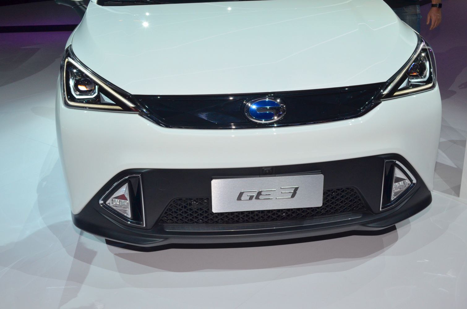 Close-up of front grille and LED headlights.