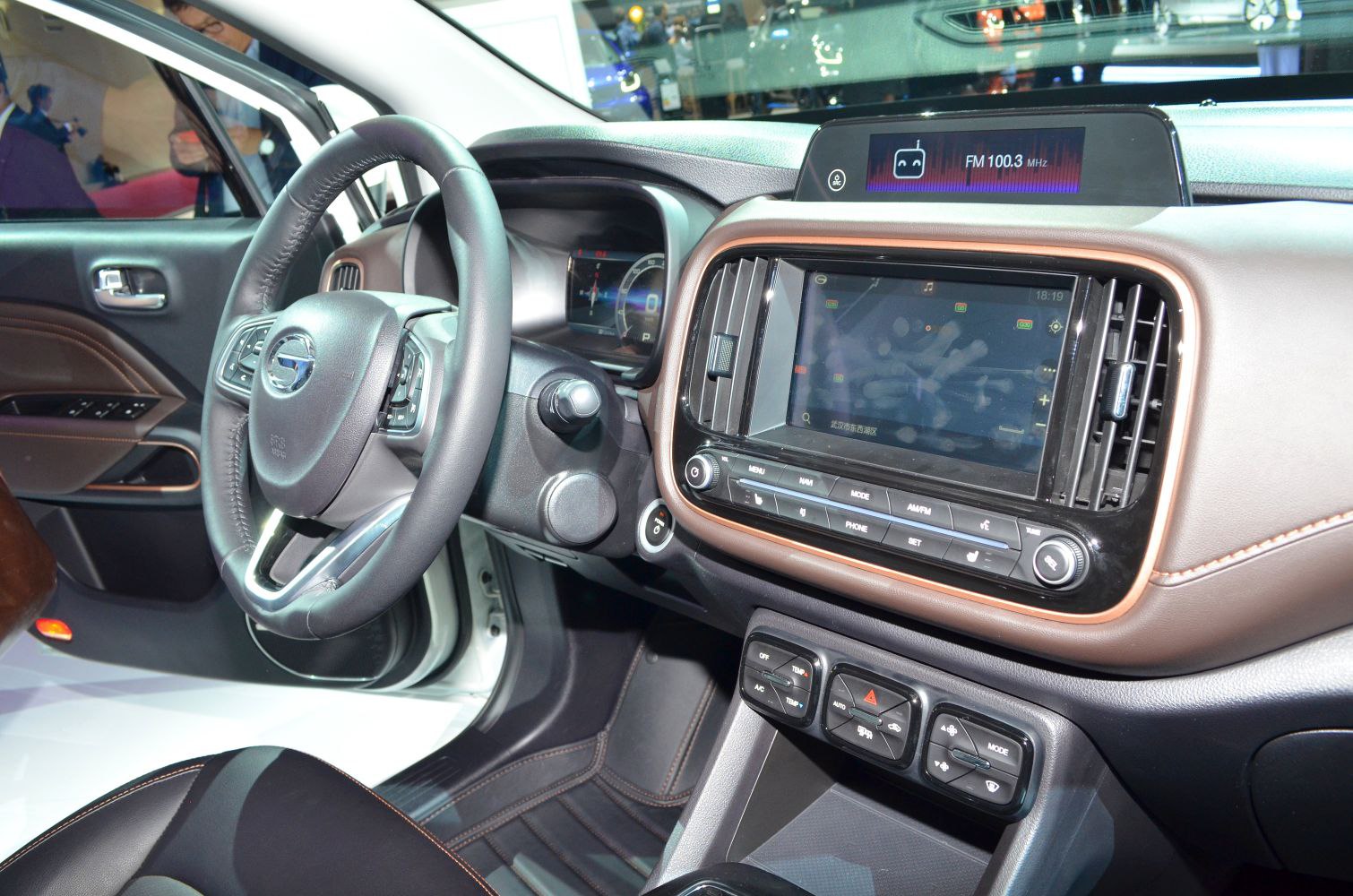 Modern car interior with digital displays and multifunction steering wheel