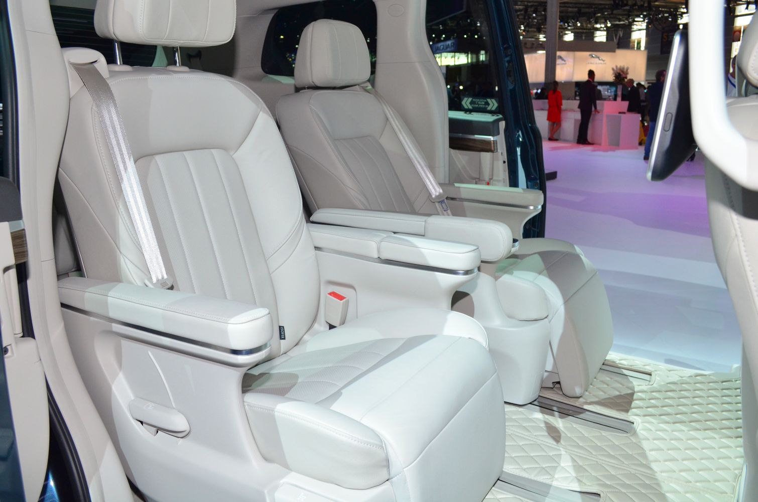 Leather captain seats with armrests and seatbelts