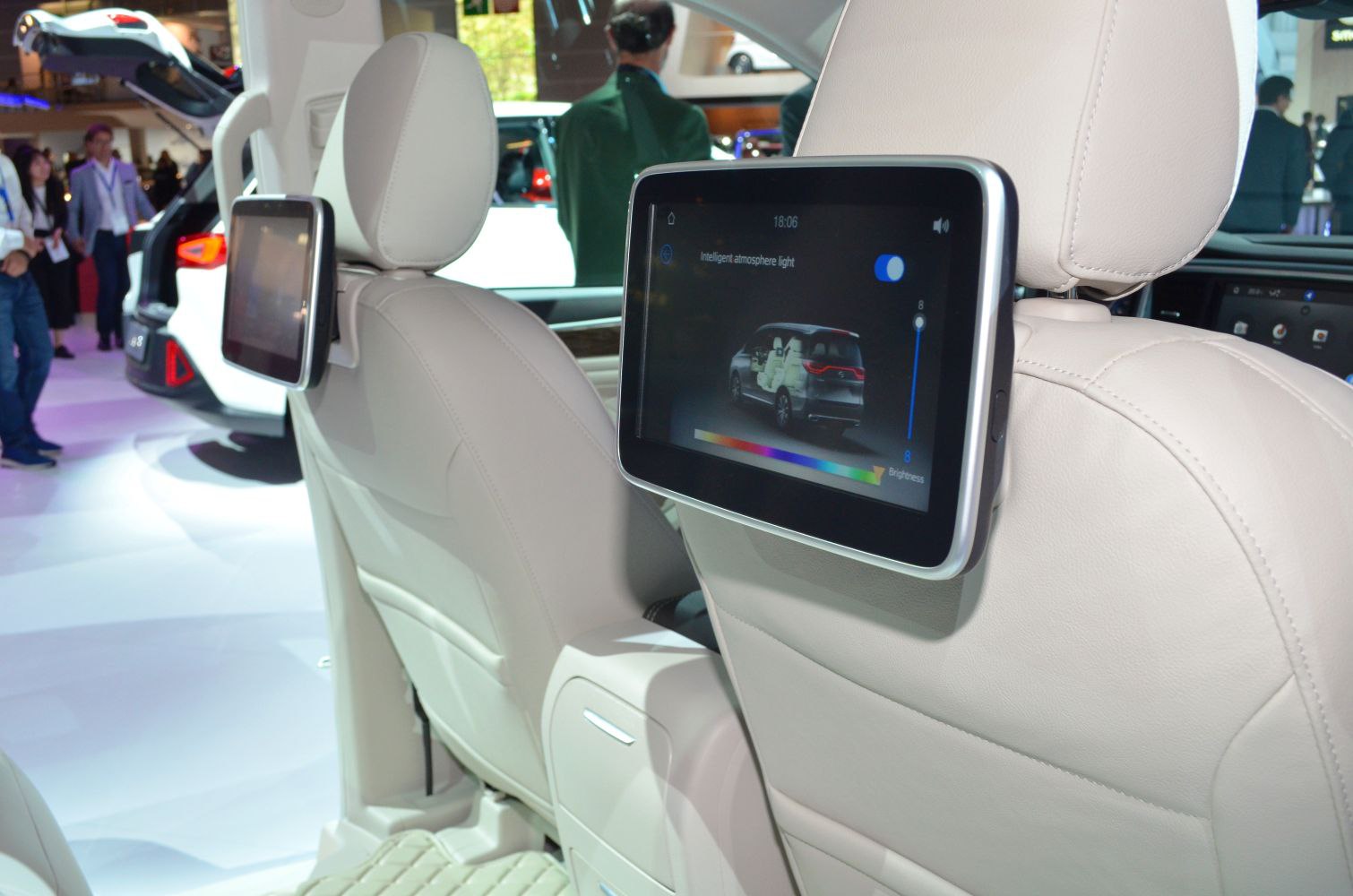 Rear seat entertainment screens and beige leather upholstery